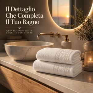 Set asciugamani bagno 2 pz in spugna con bordo jacquard  viso 50×100 cm ospite 40×60 cm